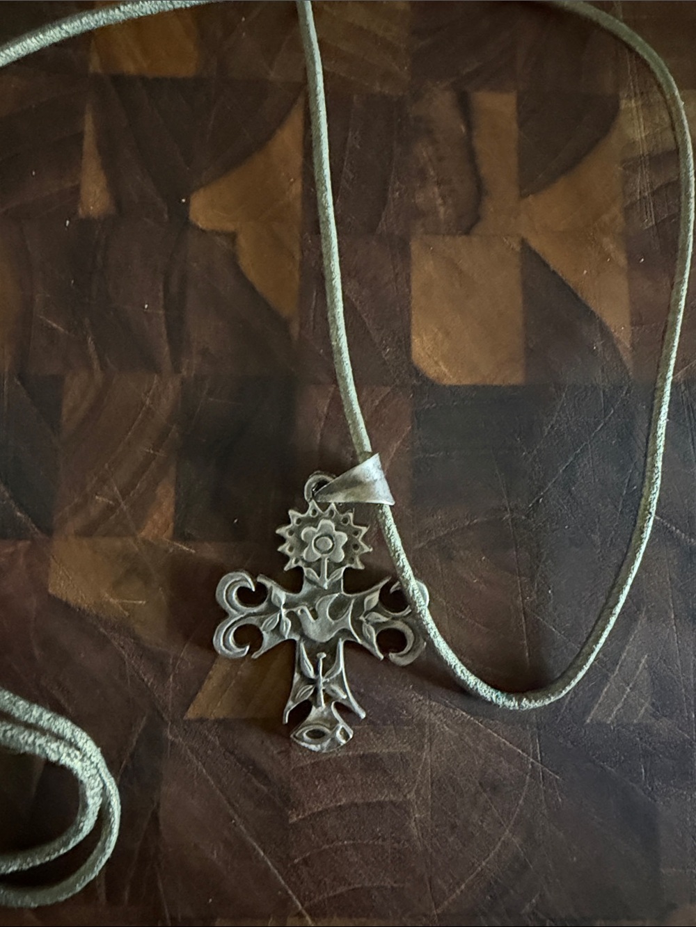 Sterling cross on a leather cord